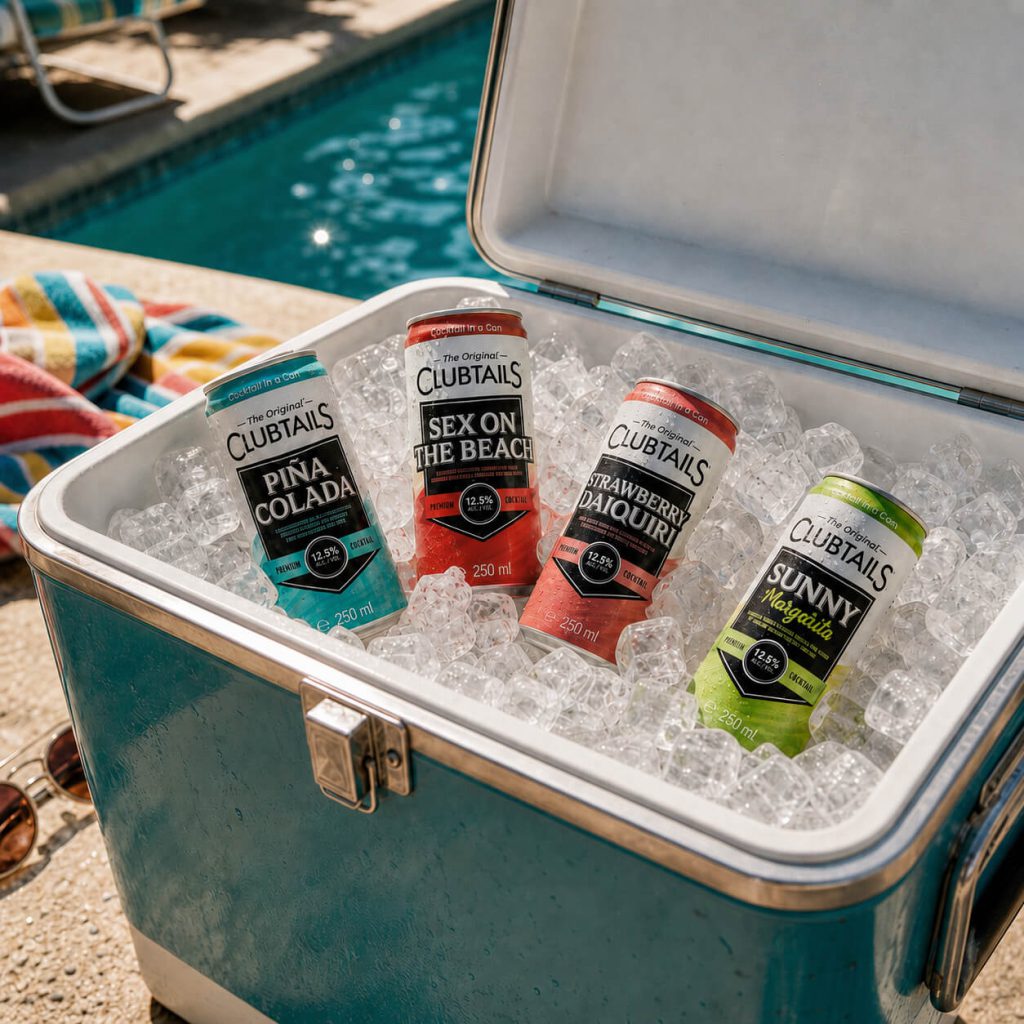Clubtails Piña Colada, Sex on the Beach, Strawberry Daiquiri and Sunny Margarita cocktail cans chilled on ice by a pool.